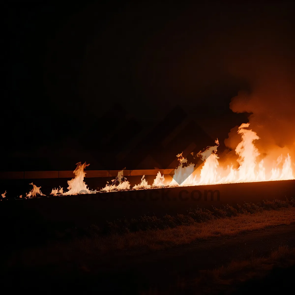 Picture of Vibrant Sunset Sky with Silhouetted Flamethrower