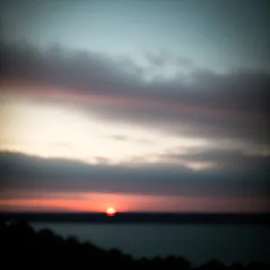 Golden Horizon: Serene Sunset over Coastal Waves