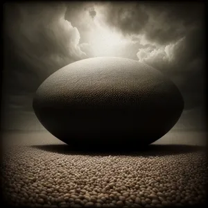 Tranquil Harmony: Balanced Stones Amidst Sand