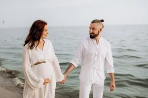 Happy couple enjoying beach vacation by the sea