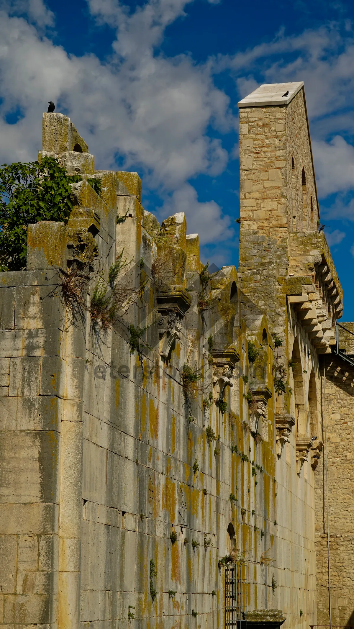 Picture of Historic English Cathedral Tower in City Skyline.