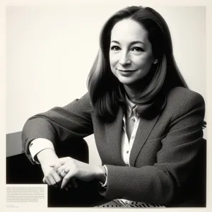 Smiling businesswoman working on laptop in office