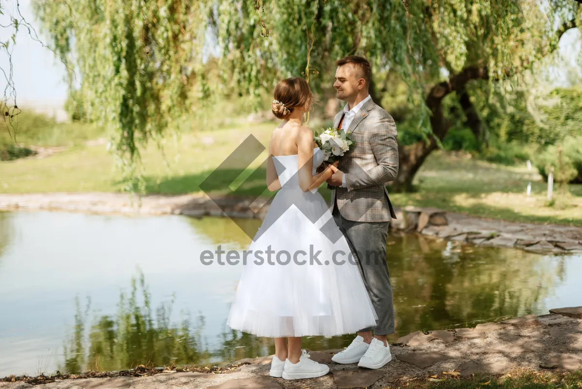 Picture of Happy Wedding Couple Outdoors Smiling in the Park