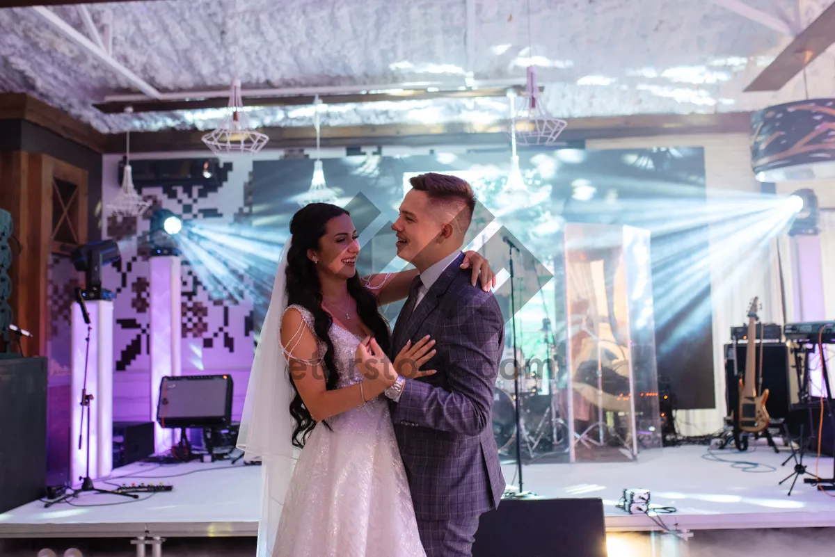 Picture of Happy groom and bride in wedding attire