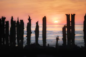Silhouette skyline with sunset over the sea.