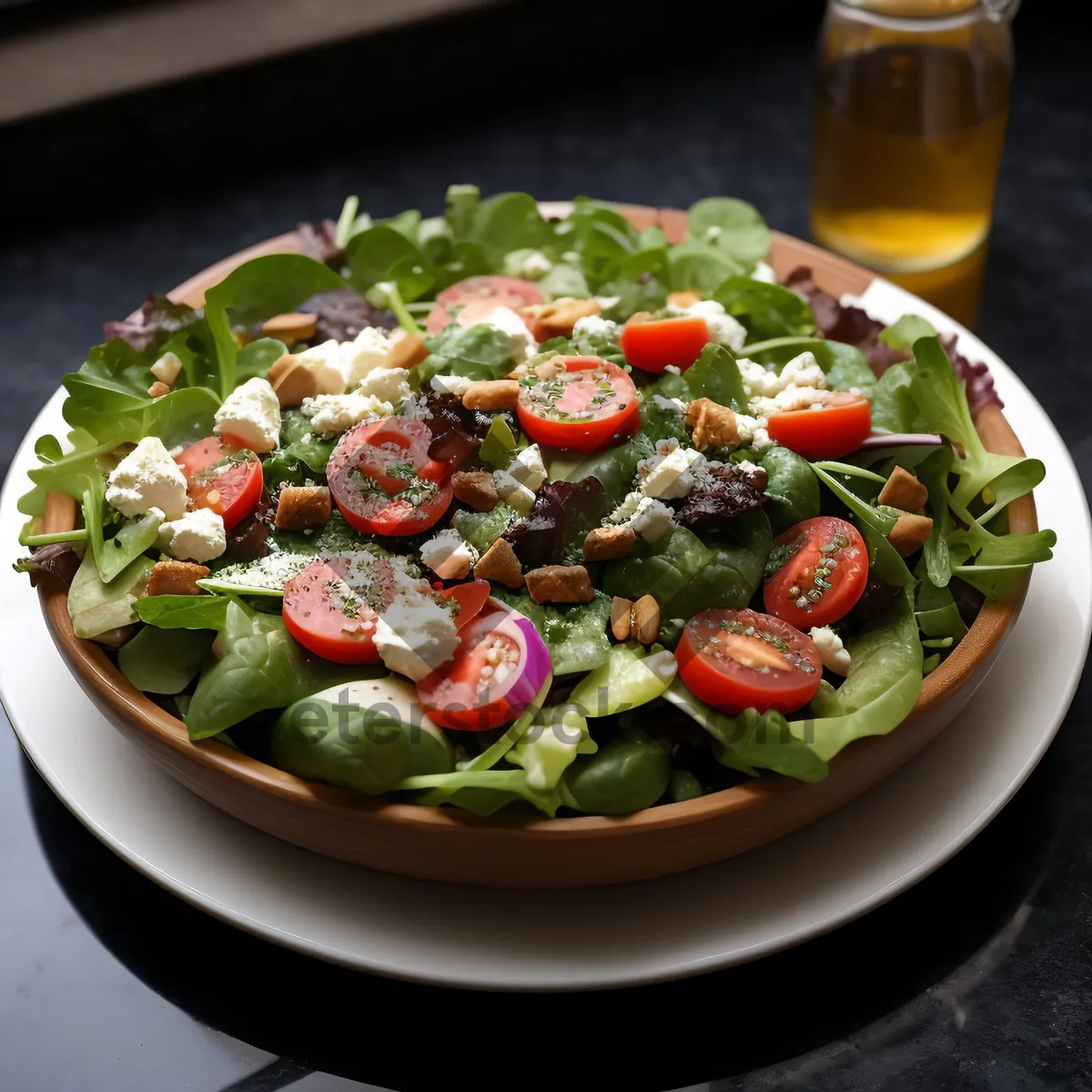 Picture of Fresh and colorful vegetable salad with tomatoes and olives.