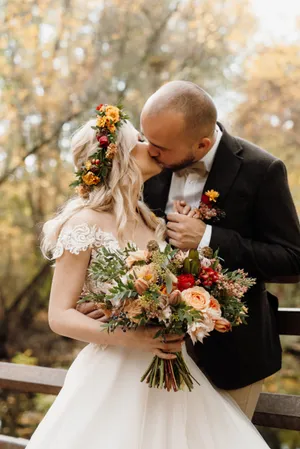 Happy groom and bride celebrate love outdoors