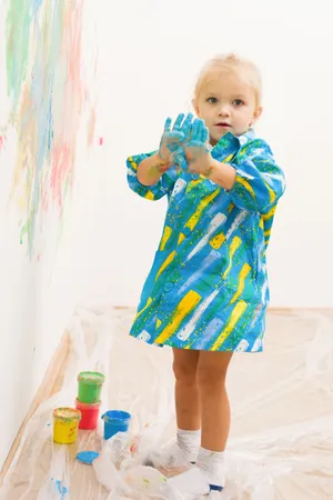 Happy smiling child portrait with toy in studio