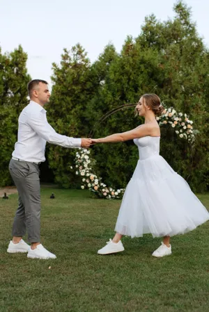 Happy Couple in Wedding Attire Smiling Outdoors