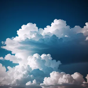 Fluffy Clouds in Azure Sky
