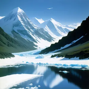 Snow-capped Alpine Peaks Reflecting in Serene Glacier Lake