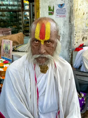 White-masked comedian performing in disguise