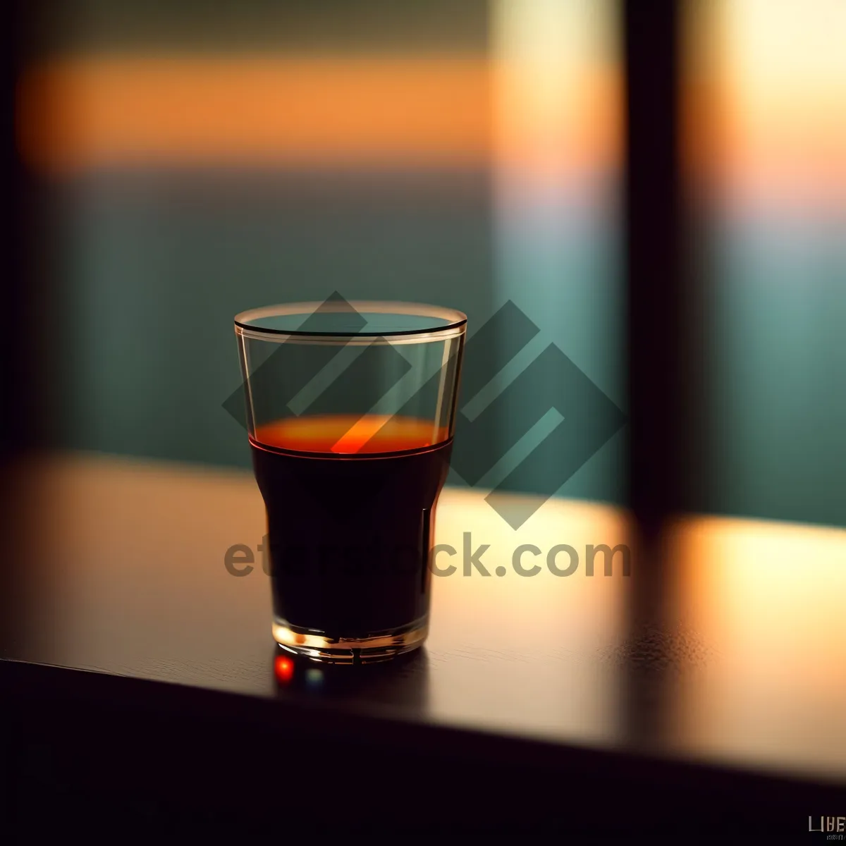 Picture of Frothy Beer Glass on Bar Counter