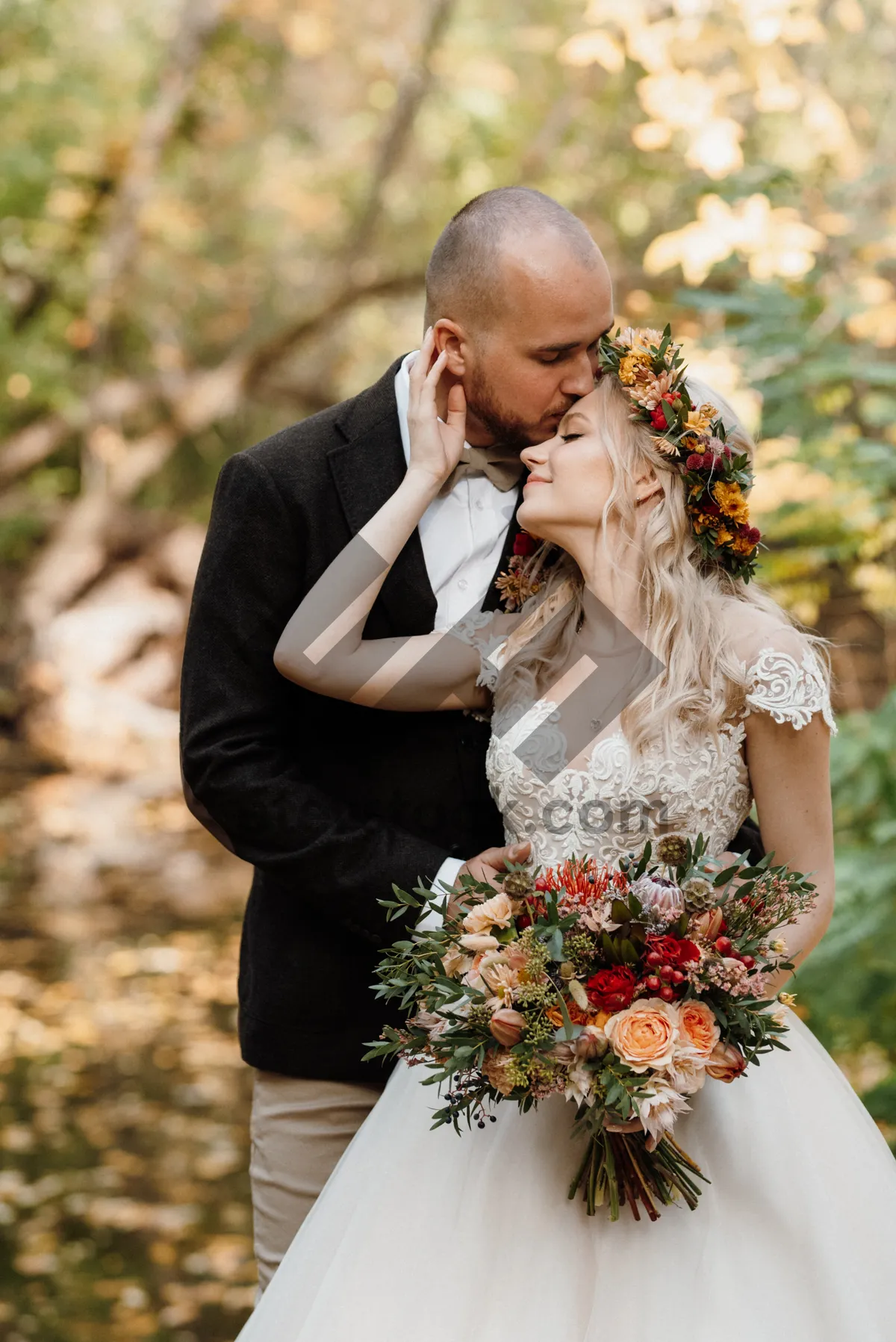 Picture of Happy couple smiling on their wedding day.