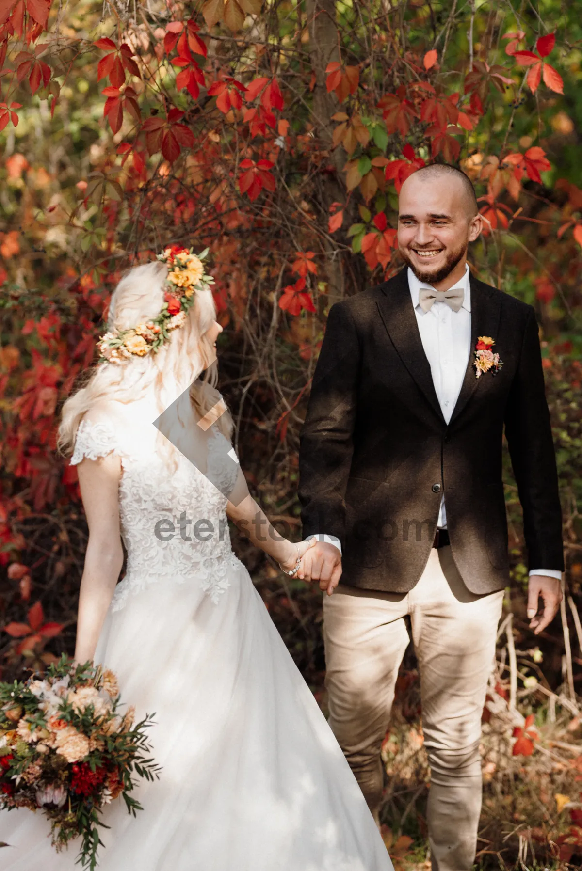 Picture of Happy groom and bride celebrating their wedding day outdoors