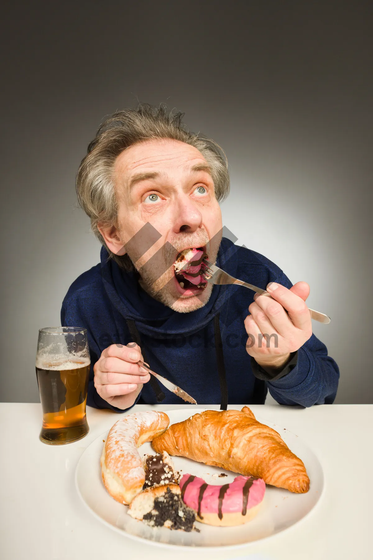 Picture of Happy man enjoying breakfast with coffee and juice