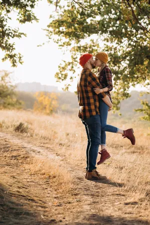 Happy Male Farmer Enjoying Outdoors in Field Among Grass