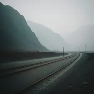 Speeding through mountainous landscapes on an empty road