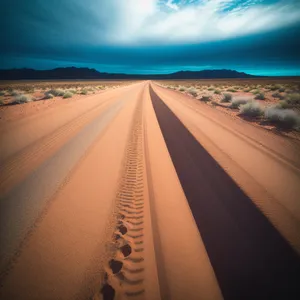 Golden Horizon: Tranquil Sunset Over Desert Road