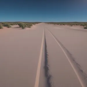 Desert Drive: Tranquil highway through sandy dunes