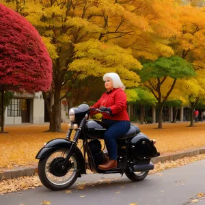 Man riding motor scooter on road with helmet