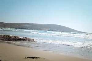 Tropical island beach with relaxing waves and sun.