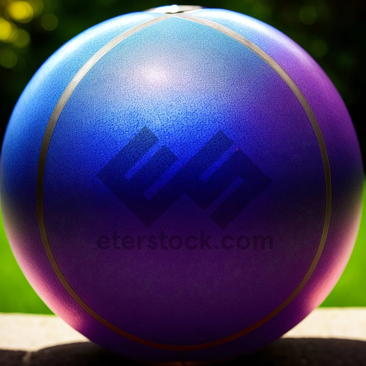 Picture of  gleaming croquet ball on reflective globe 