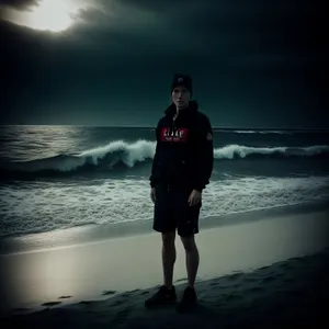 Sunset Silhouette: Man Enjoying Beach Vacation