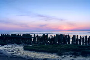 Seaside Summer Skyline with Pier and Waves