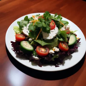 Gourmet salad with fresh vegetables and cheese plate.