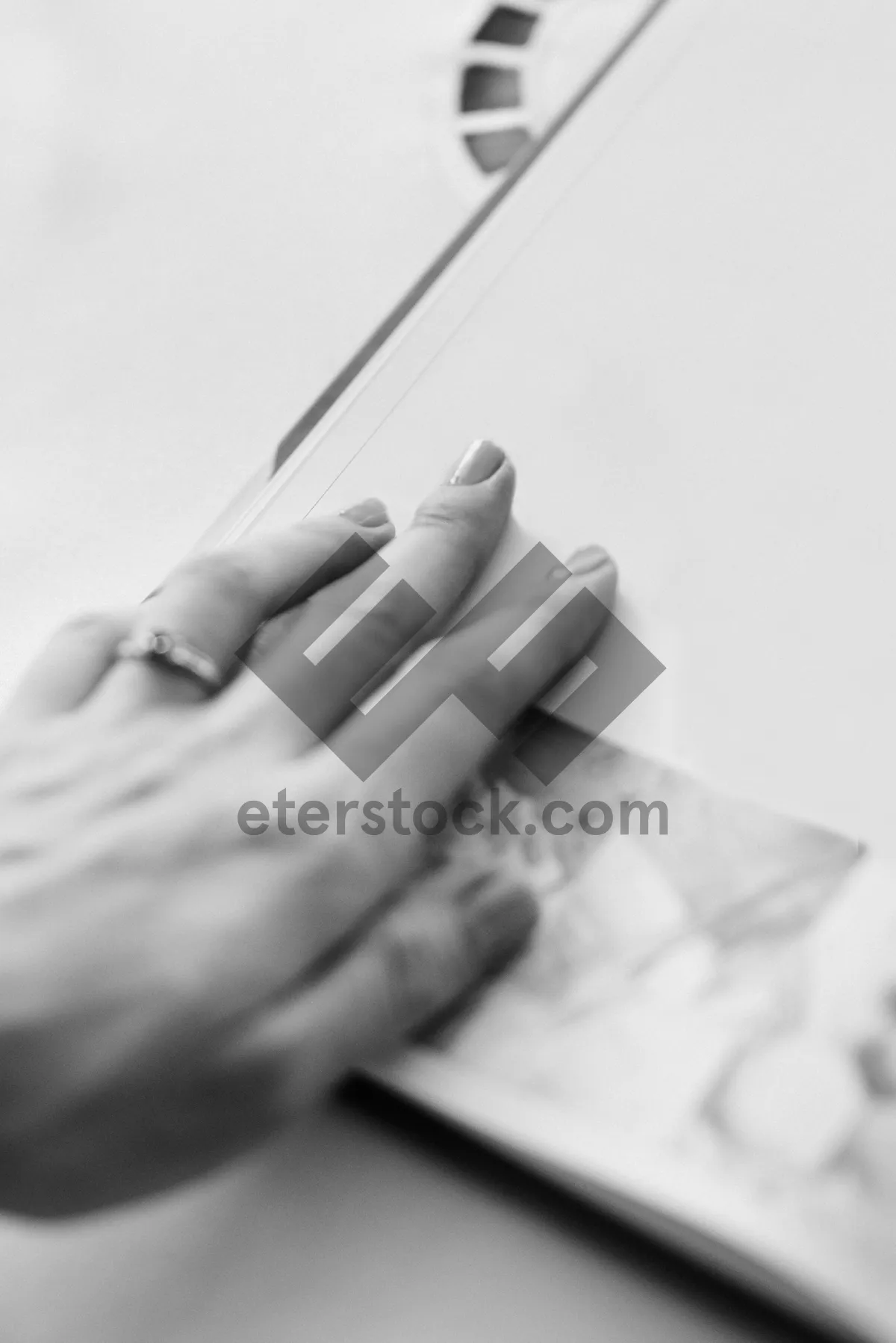 Picture of Close up of person's hand in office setting.