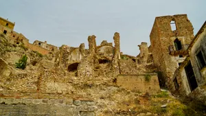 Ancient Castle Tower on Mountain Ridge Skyline.