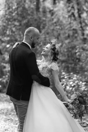 Happy couple celebrating love with a wedding bouquet.