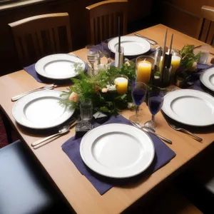 Luxury dining table setting with drink and napkin.