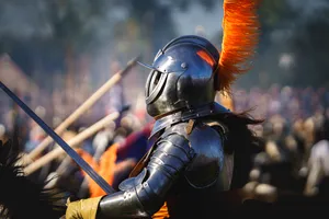 Male warrior with shield and sword in historical armor.