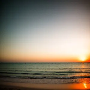 Serene Sunset Over Ocean's Horizon