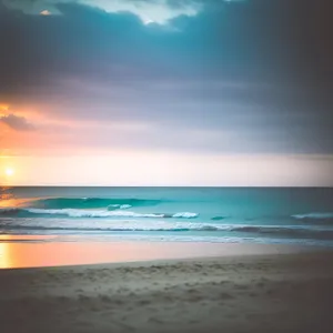 Serene Shoreline and Turquoise Waves at Sunset