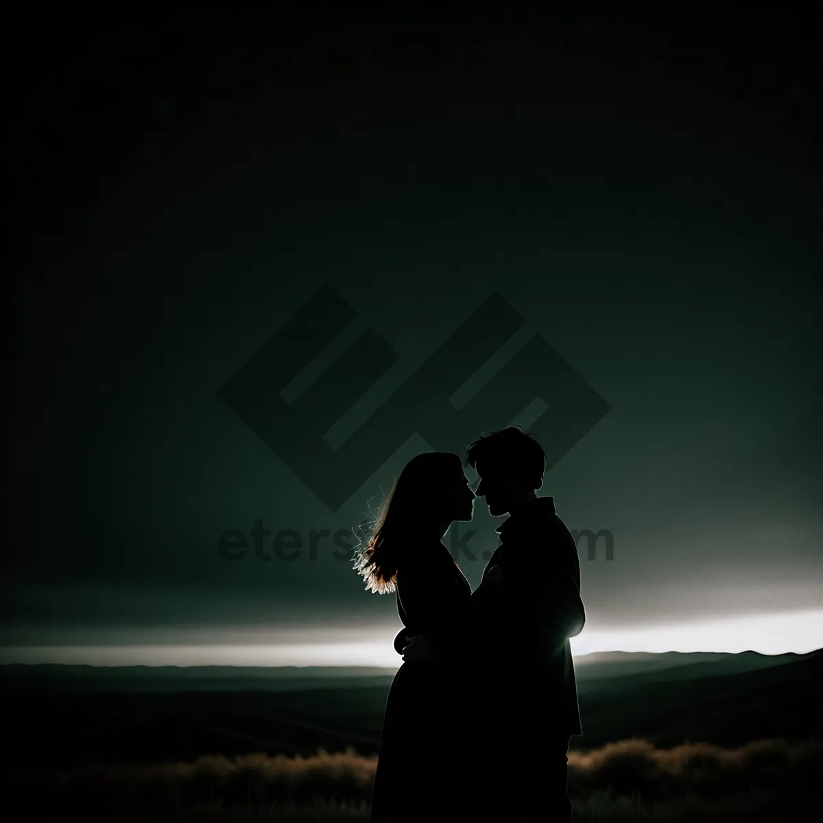 Picture of Romantic Sunset Silhouette of Newlywed Couple on Beach