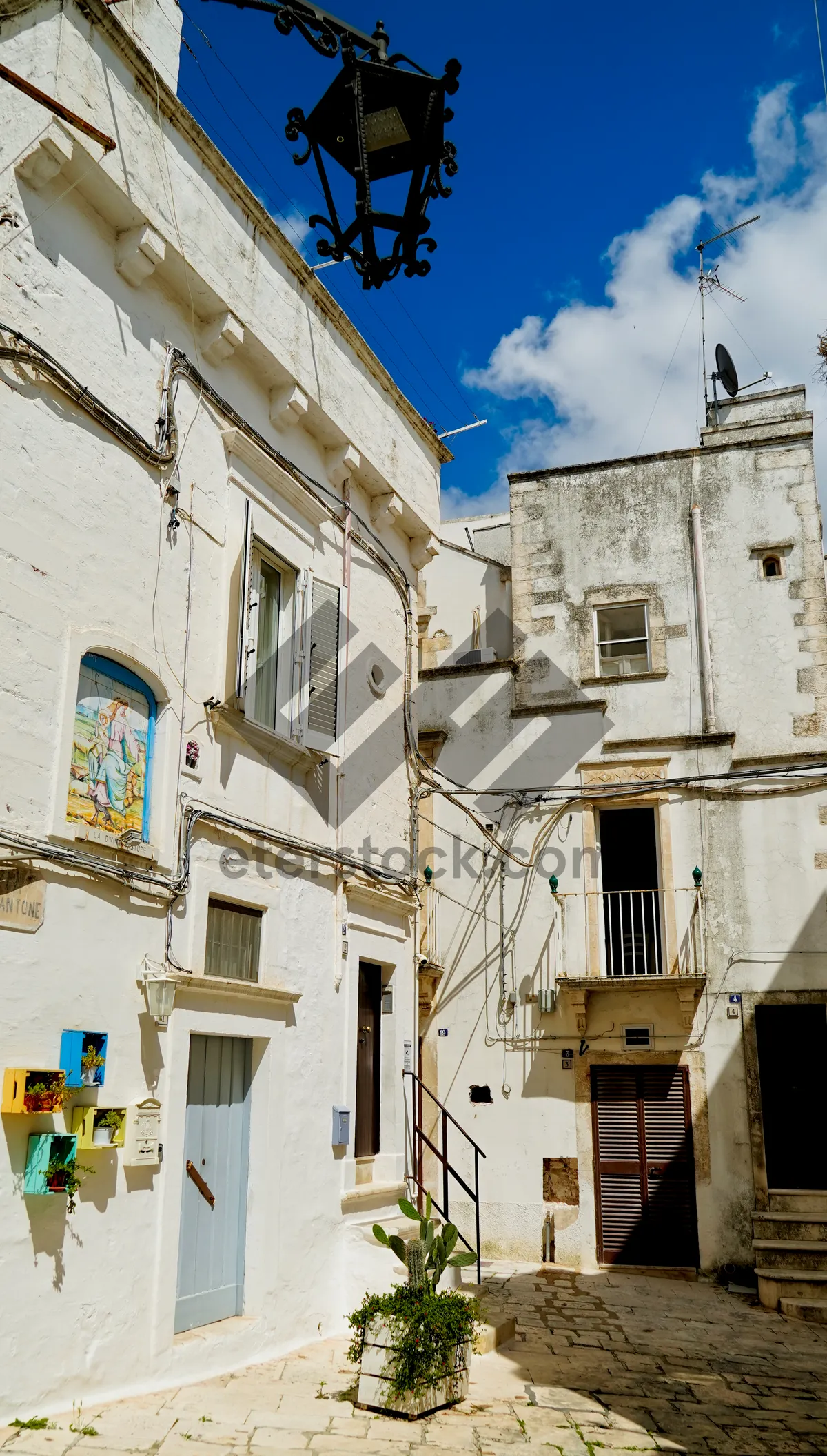 Picture of Historic stone monastery with balcony overlooking old city street.