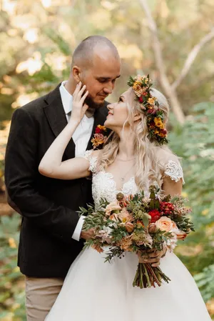 Happy Bride and Groom Celebrating Wedding Outdoors