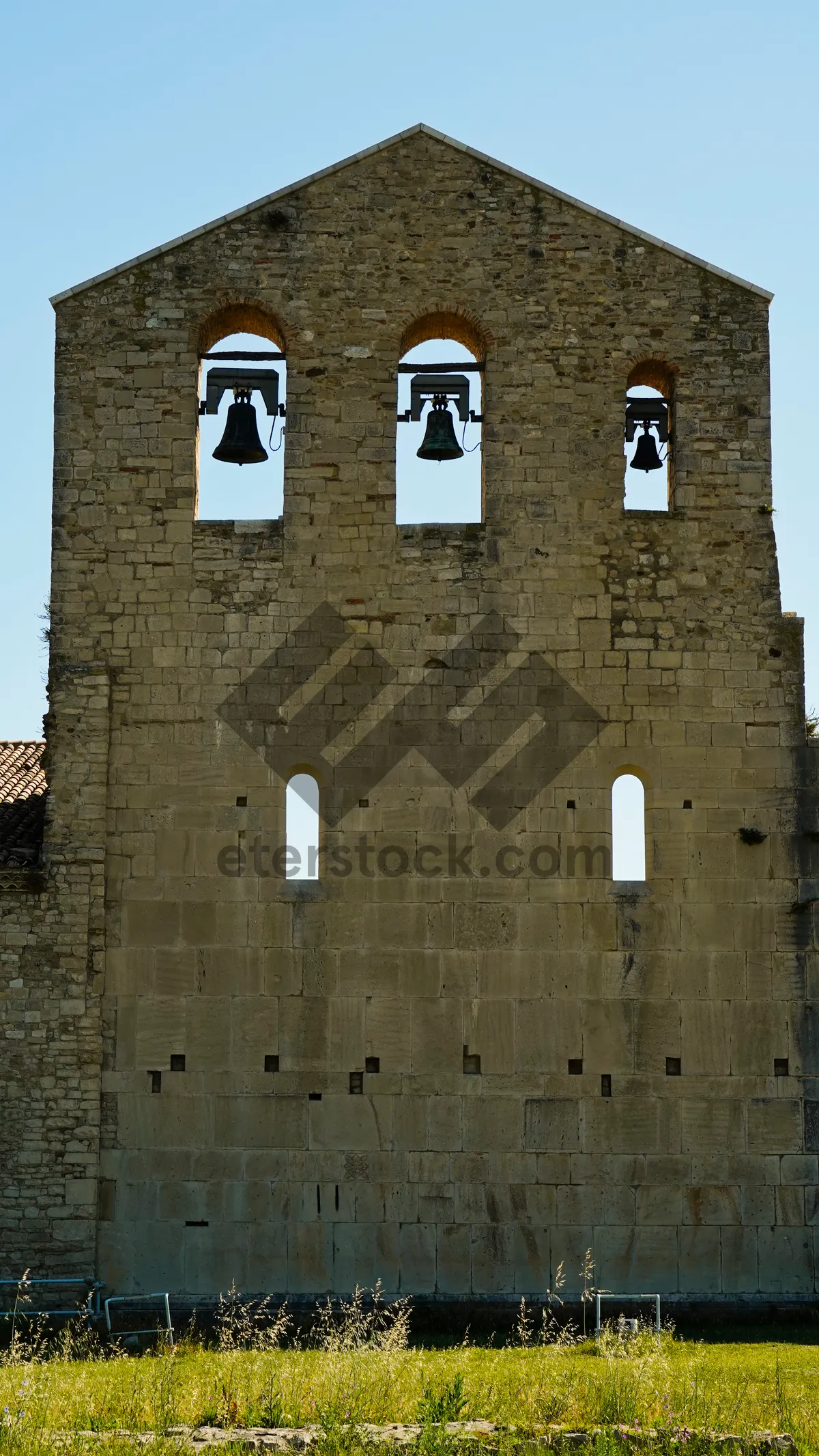 Picture of Medieval church tower in historic town square.