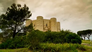 Ancient Castle Tower overlooking Historic Stone Fortress Ruins.