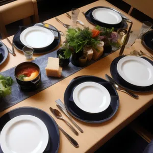 Restaurant meal on tabletop with cup and dish