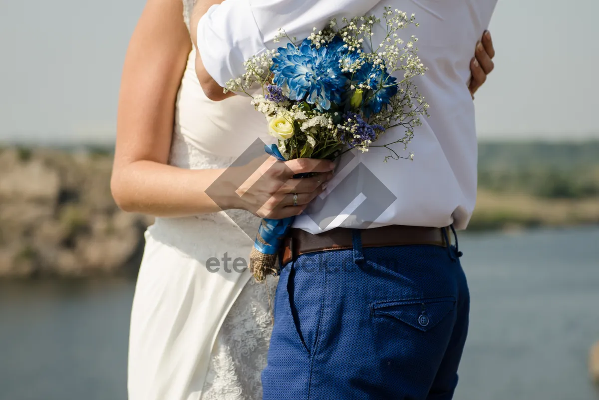 Picture of Happy bride in park with bouquet