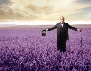 Happy person enjoying summer outdoors in wheat field