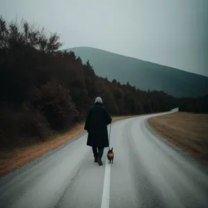 Mountain Road Journey amidst Majestic Clouds