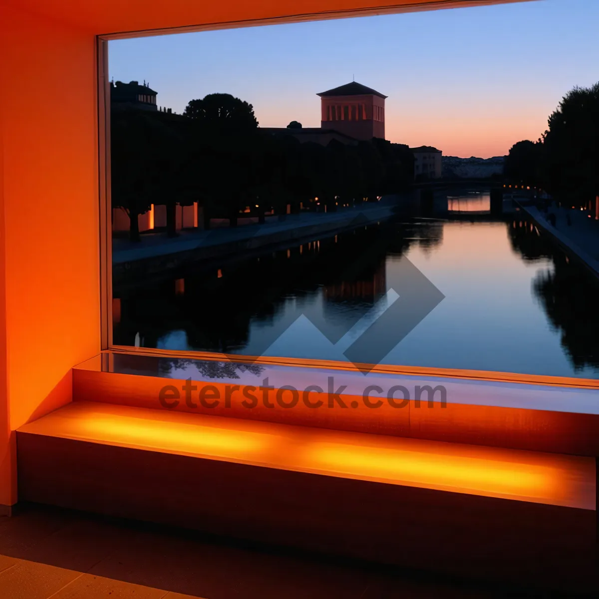 Picture of City skyline reflecting on calm river at evening.