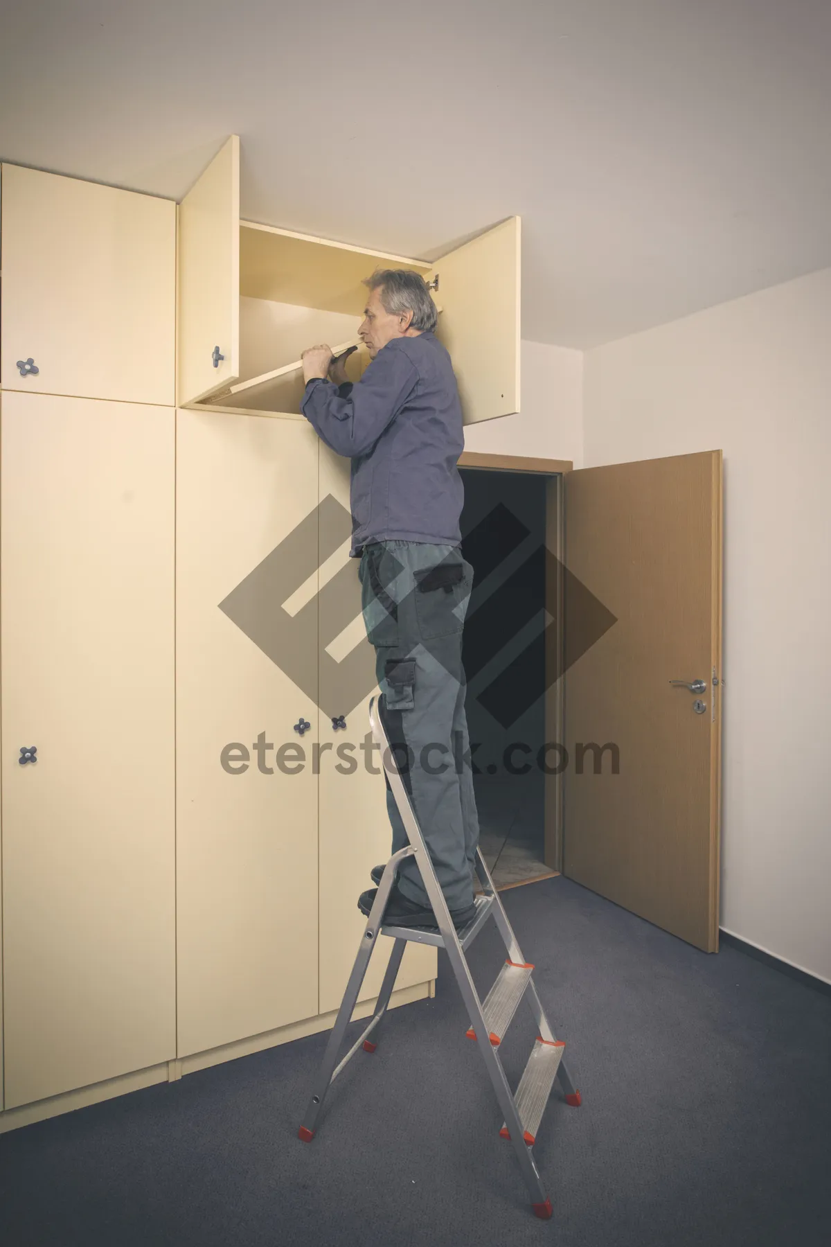 Picture of Man using cleaning swab in home