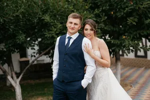 Happy Wedding Couple Smiling Together Outdoors