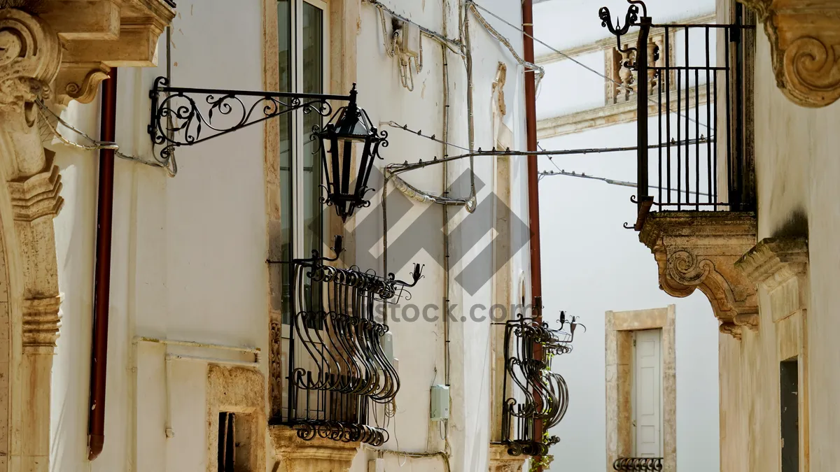 Picture of Old city architecture with balconies and electricity wires